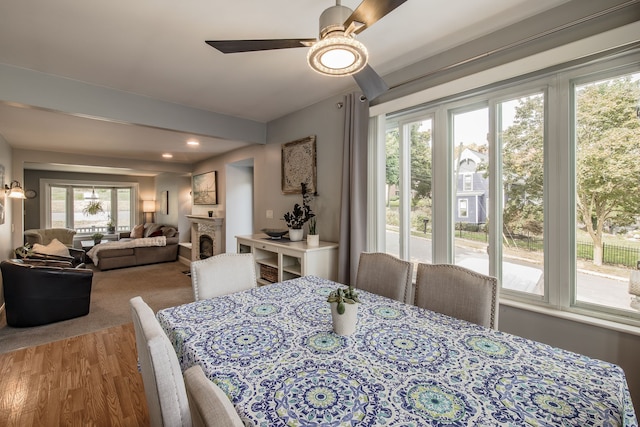 dining area featuring hardwood / wood-style floors and ceiling fan