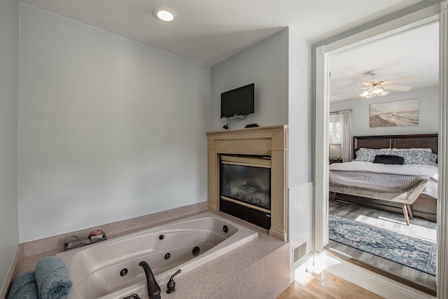 bathroom featuring a bath and wood-type flooring