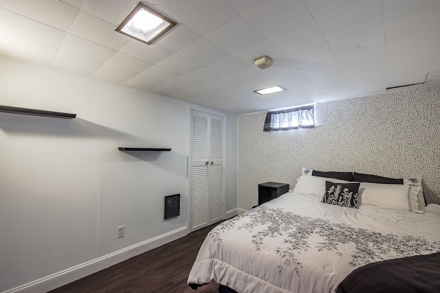 bedroom with dark wood-type flooring