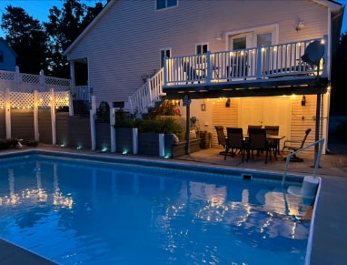 view of swimming pool with a patio and a deck