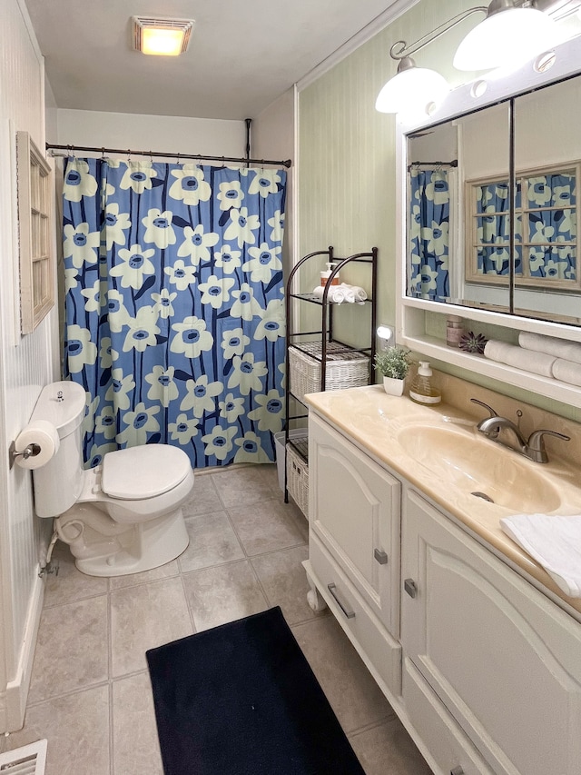 bathroom featuring tile patterned flooring, vanity, toilet, and a shower with curtain