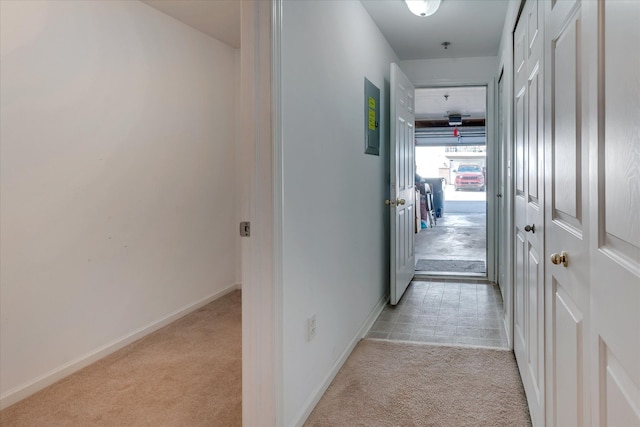 hallway featuring light carpet