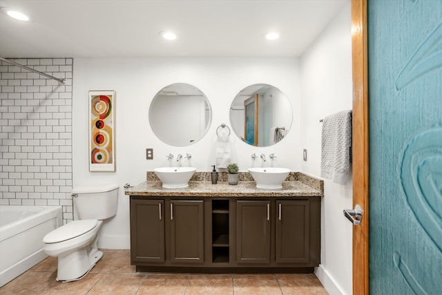 full bathroom featuring toilet, tiled shower / bath combo, tile patterned flooring, and vanity