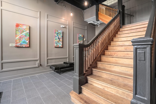 stairs featuring tile patterned floors