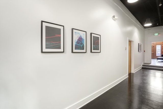 hallway featuring dark wood-type flooring