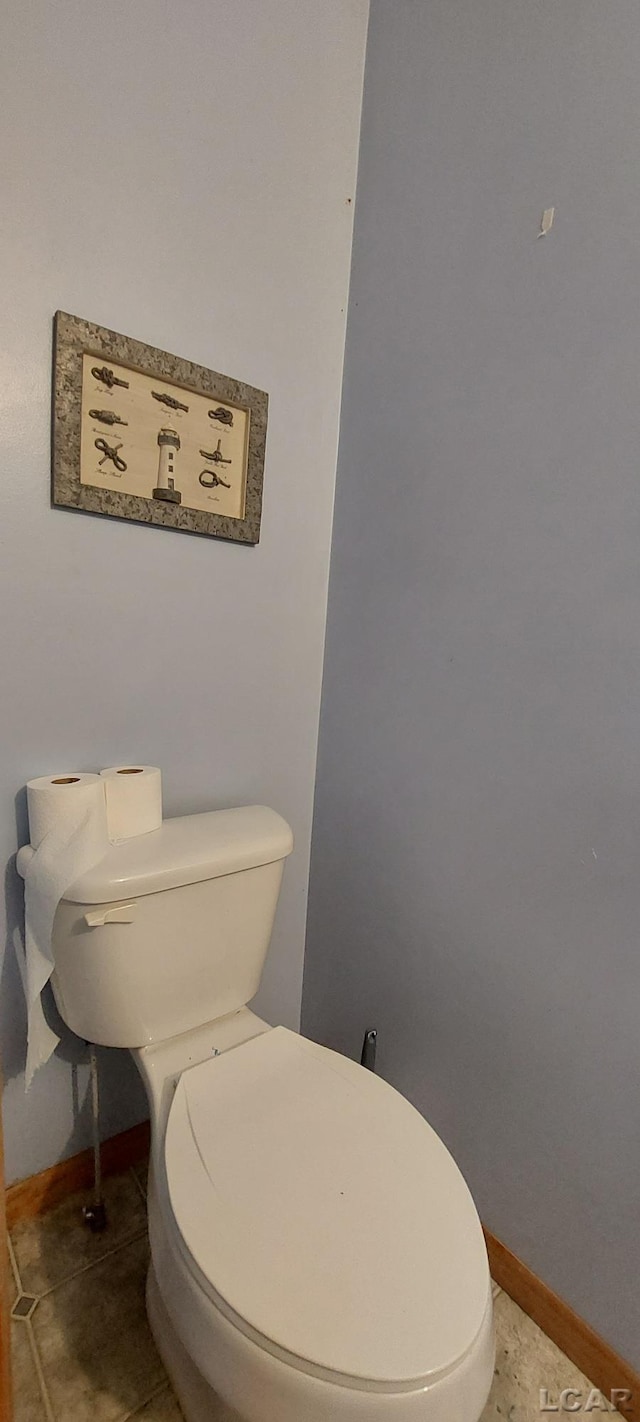 bathroom with tile patterned floors and toilet