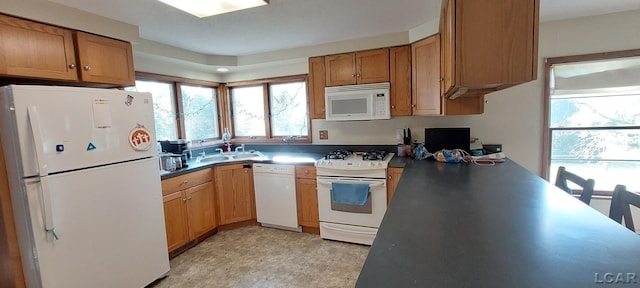 kitchen with sink and white appliances