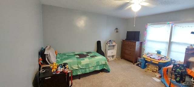 bedroom featuring ceiling fan and light colored carpet