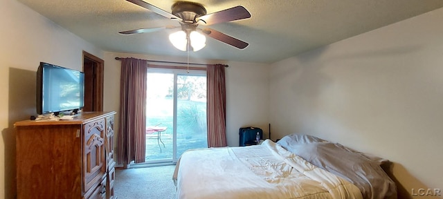 carpeted bedroom featuring ceiling fan, a textured ceiling, and access to outside