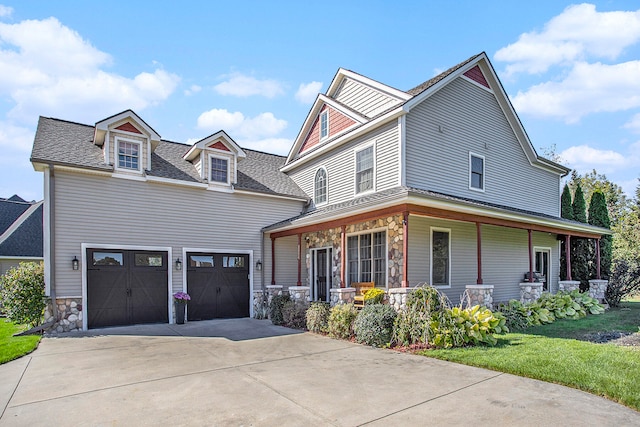 view of front of house with a garage and a front lawn