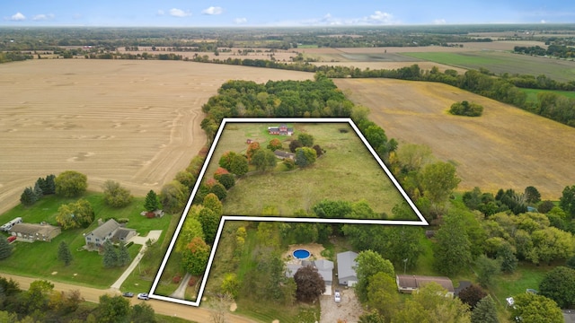 birds eye view of property featuring a rural view