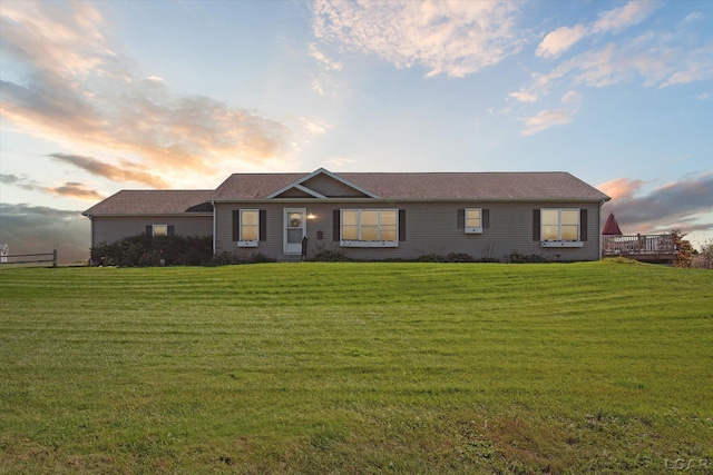 ranch-style house featuring a lawn