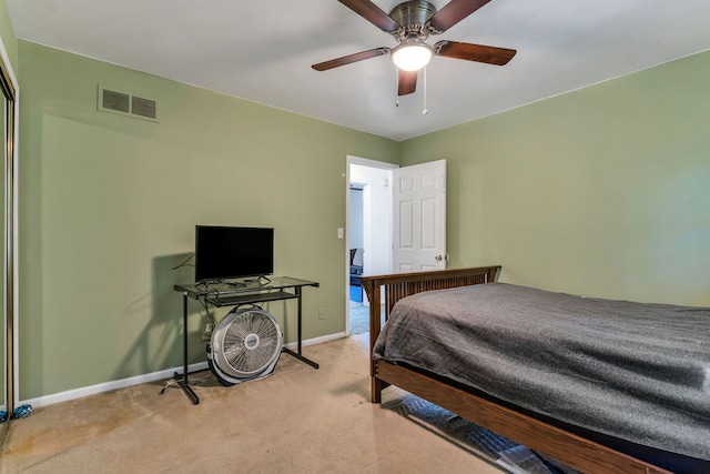 bedroom featuring light carpet and ceiling fan