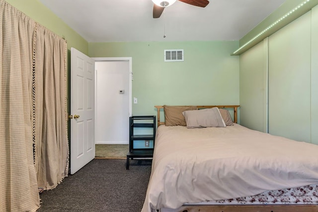 carpeted bedroom with ceiling fan