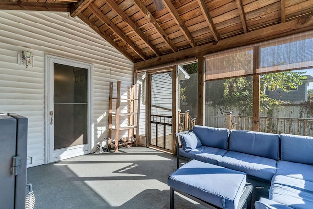 unfurnished sunroom with vaulted ceiling with beams and wooden ceiling