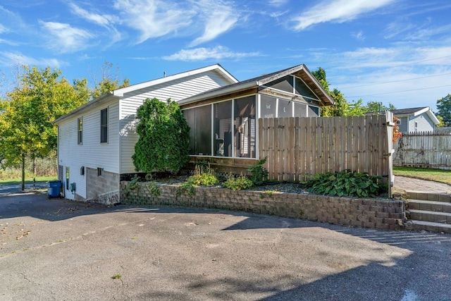 exterior space featuring a sunroom