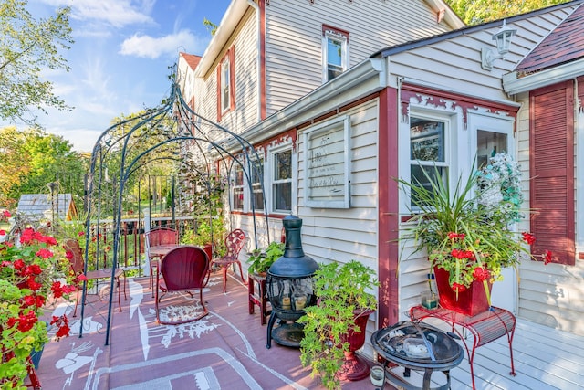 327 Reid Rd, Grand Blanc, MI 48439 - wooden terrace with outdoor dining area