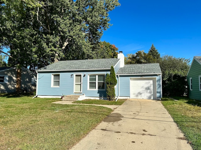 view of front facade with a front lawn and a garage