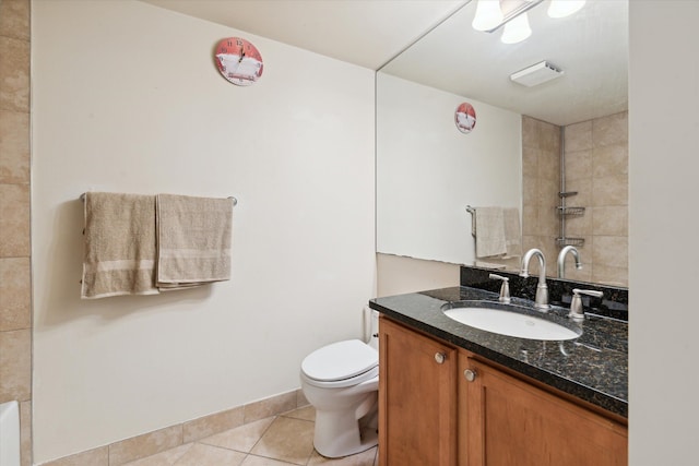 bathroom featuring tile patterned floors, vanity, and toilet