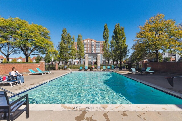 3320 Spinnaker Ln Unit 11B, Detroit, MI 48207 - community pool featuring a patio area