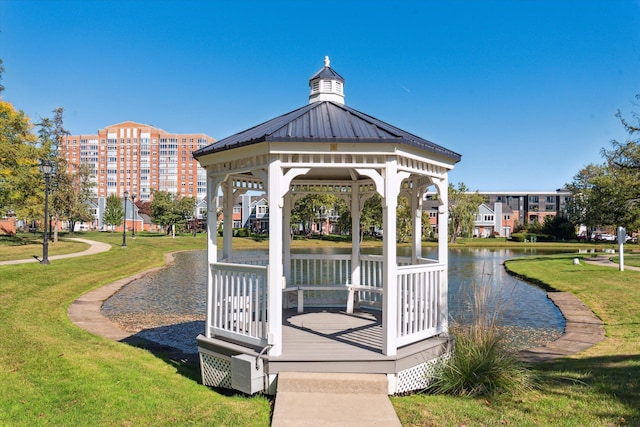 view of home's community featuring a gazebo, a water view, and a yard