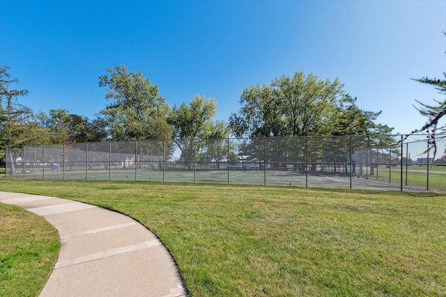 view of yard featuring a rural view and tennis court