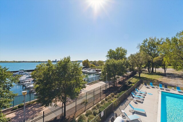 birds eye view of property with a water view