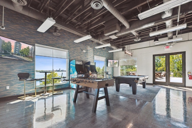 game room featuring french doors, wood-type flooring, a high ceiling, and billiards