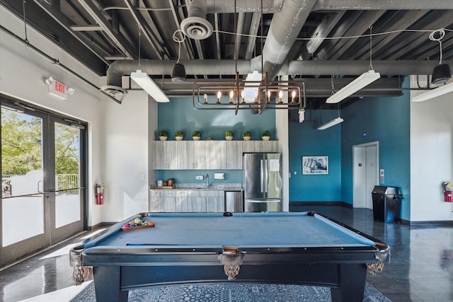 recreation room with pool table and french doors