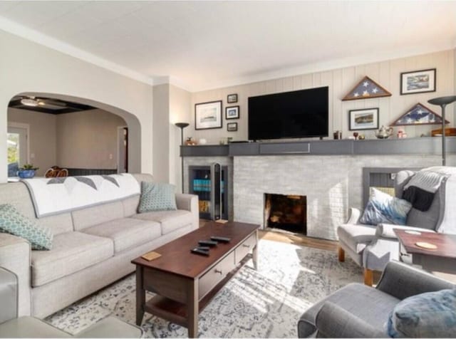 living room with a fireplace and light hardwood / wood-style flooring