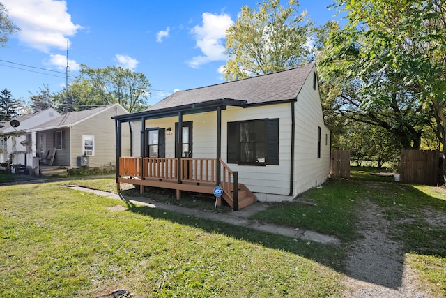 bungalow-style house with a porch and a front lawn