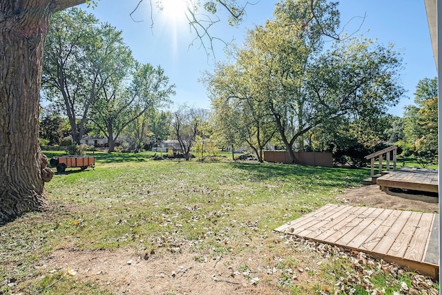 view of yard with a wooden deck