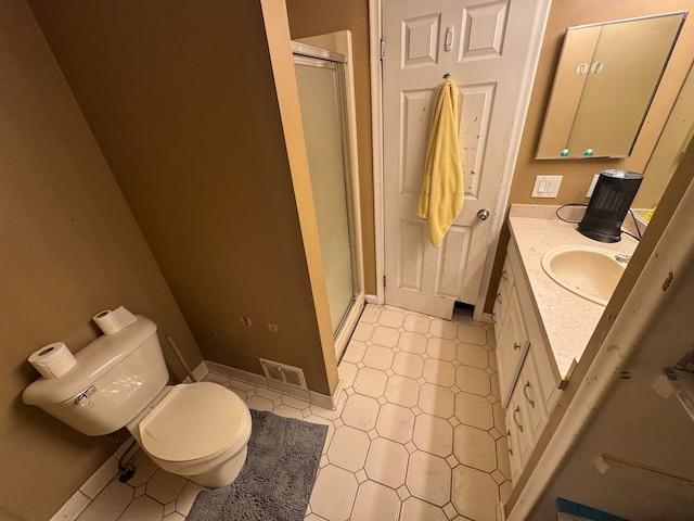 bathroom with vanity, an enclosed shower, and toilet