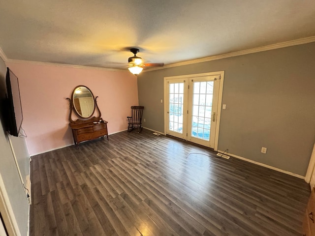 spare room with dark hardwood / wood-style floors, ceiling fan, and ornamental molding