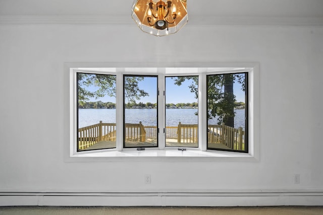 interior details featuring carpet flooring, a water view, ornamental molding, and a baseboard heating unit