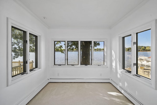 unfurnished sunroom featuring a water view, baseboard heating, and a healthy amount of sunlight