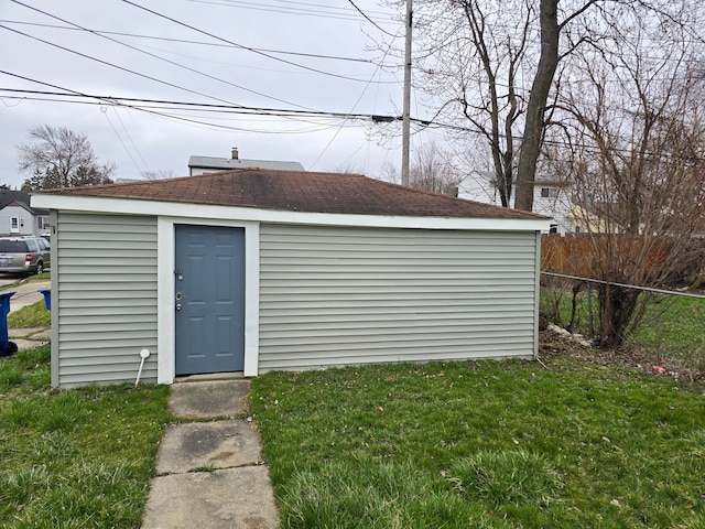 view of outdoor structure featuring a lawn