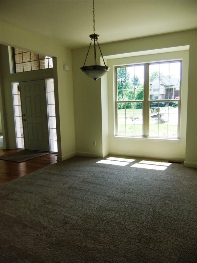48945 Tuscan Hls, Plymouth, MI 48170 - foyer featuring baseboards and carpet flooring