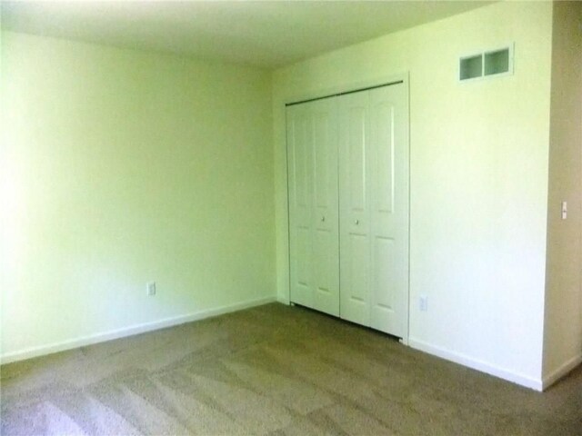 48945 Tuscan Hls, Plymouth, MI 48170 - unfurnished bedroom with carpet, baseboards, and a closet
