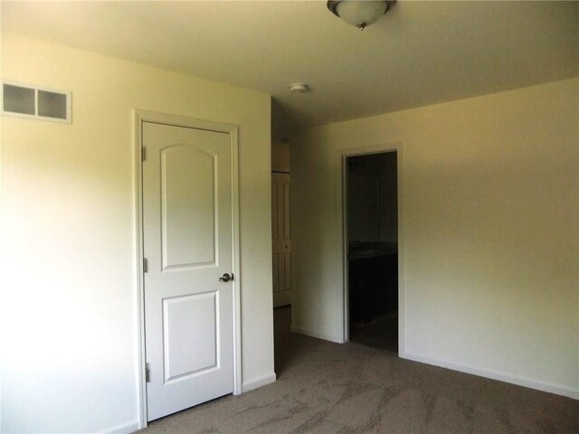 48945 Tuscan Hls, Plymouth, MI 48170 - unfurnished bedroom featuring light carpet and baseboards