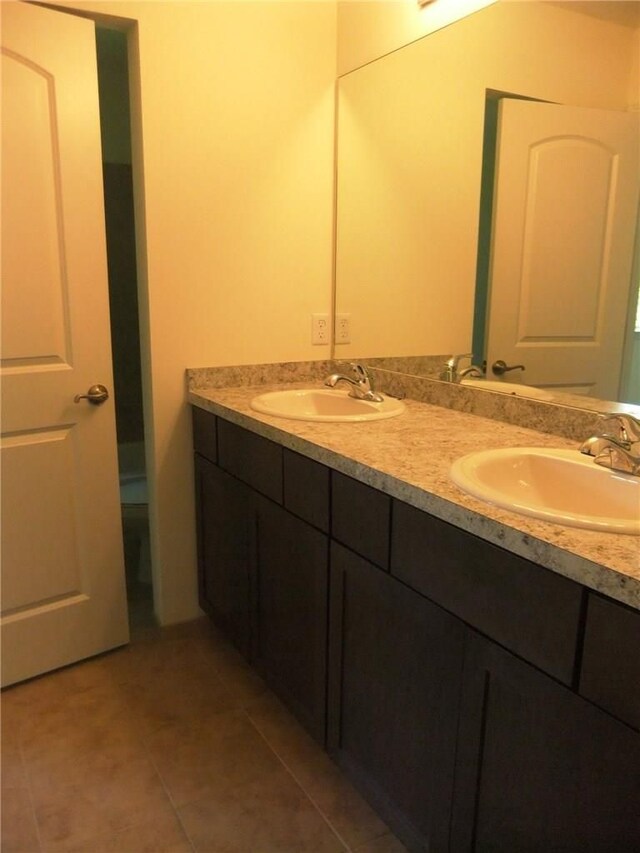48945 Tuscan Hls, Plymouth, MI 48170 - full bathroom featuring double vanity and tile patterned floors