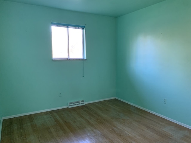 empty room featuring hardwood / wood-style floors