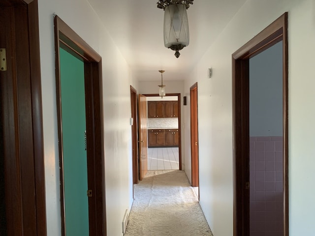 hallway featuring light carpet