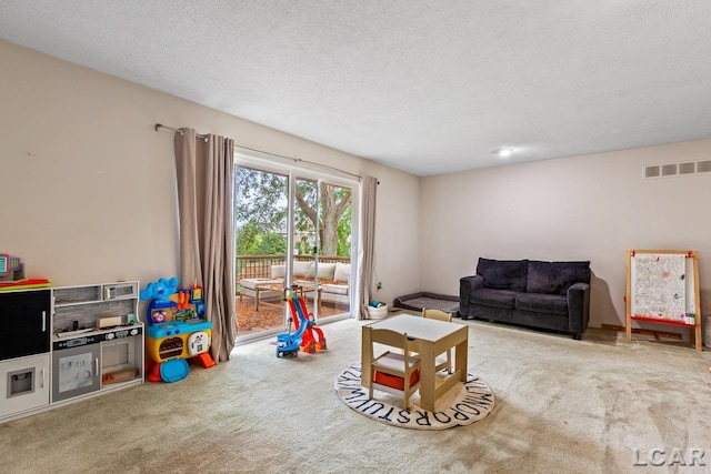 living room with carpet and a textured ceiling