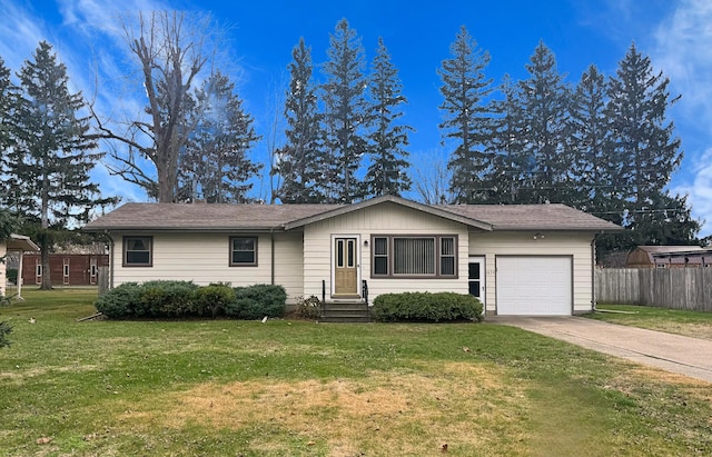 ranch-style home with a front yard and a garage