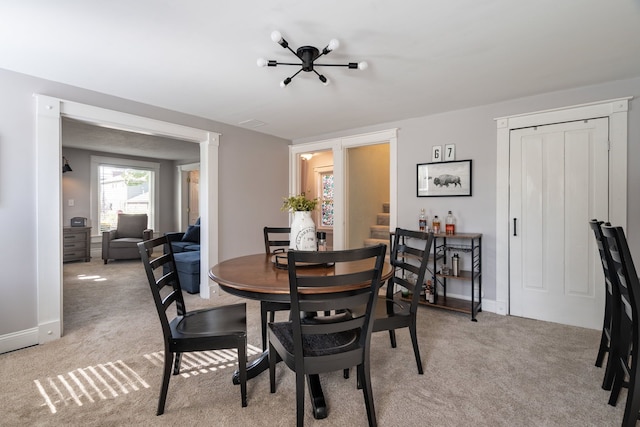 view of carpeted dining area