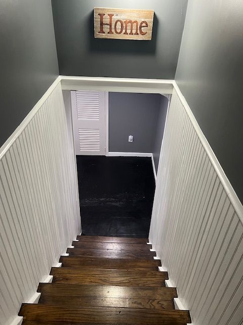 stairs with hardwood / wood-style floors