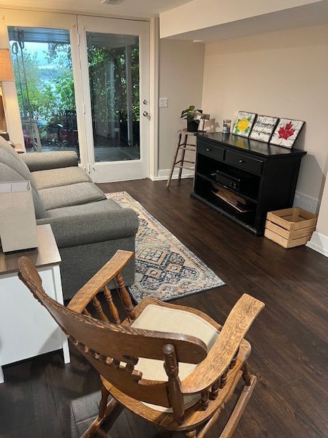 living room with dark wood-type flooring