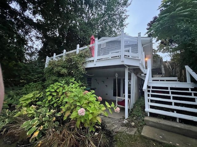 view of home's exterior with a balcony