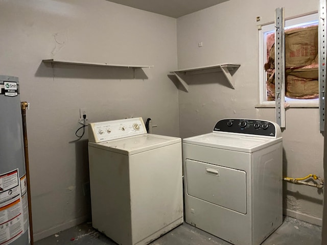 laundry room with washing machine and clothes dryer and gas water heater